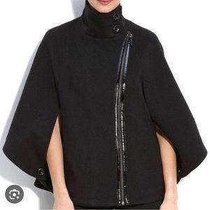 Black cape with diagonal zipper with leather detail
